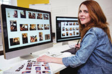 Young woman video editor sitting at her terminal