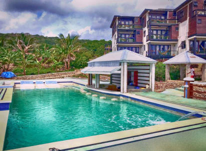 Photo of a tropical hotel swimming pool